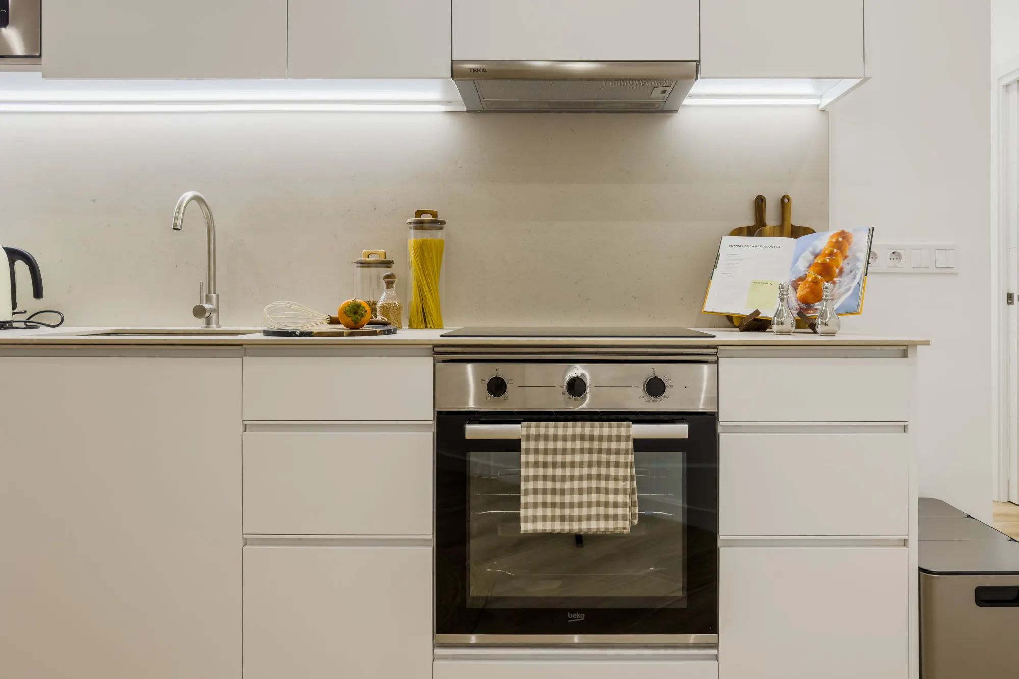 Kitchen, detail of the Còrsega project, in Barcelona, after the interior design project