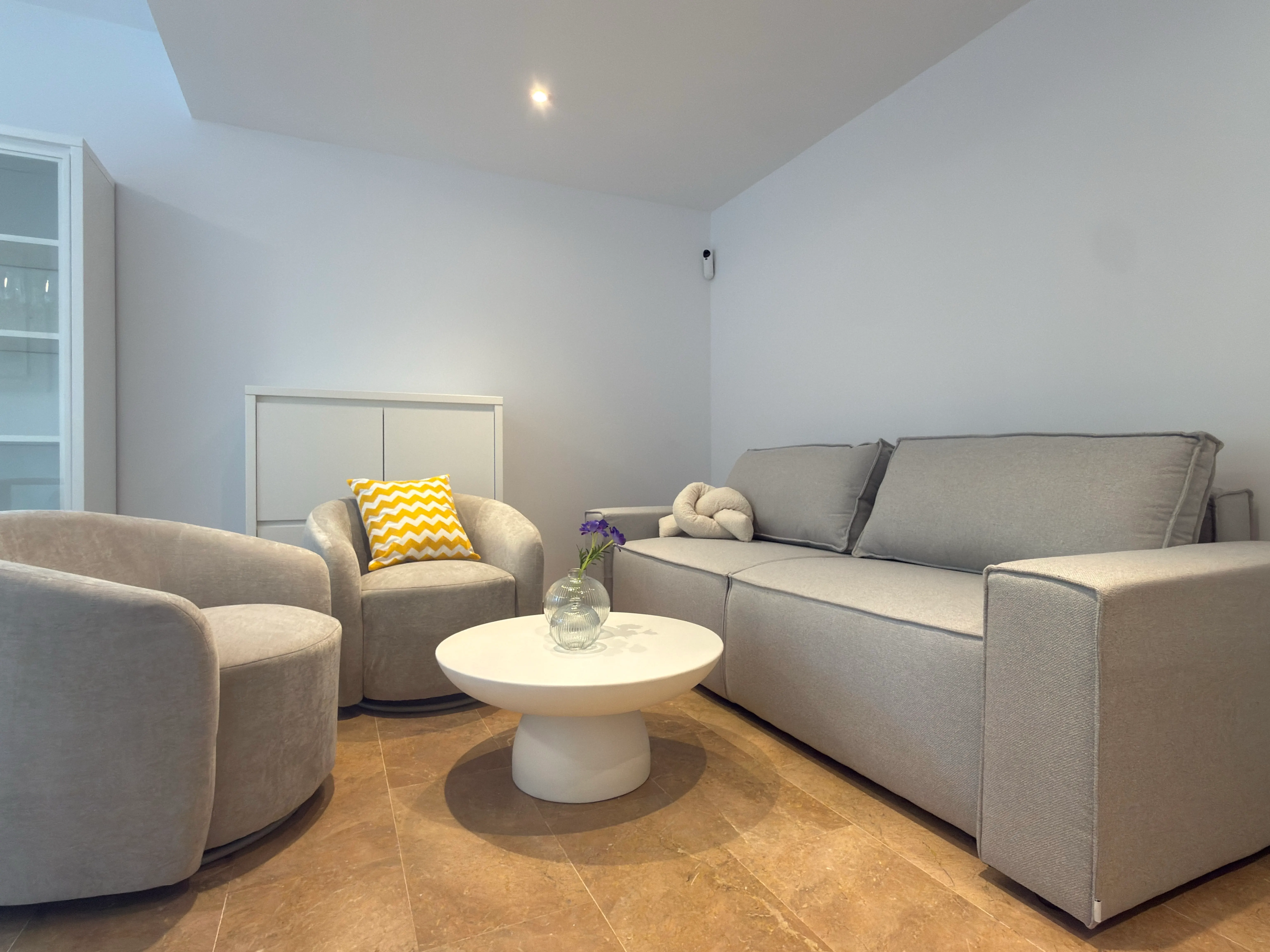 Living room of the Fenals project, in Lloret de Mar, after the interior design project