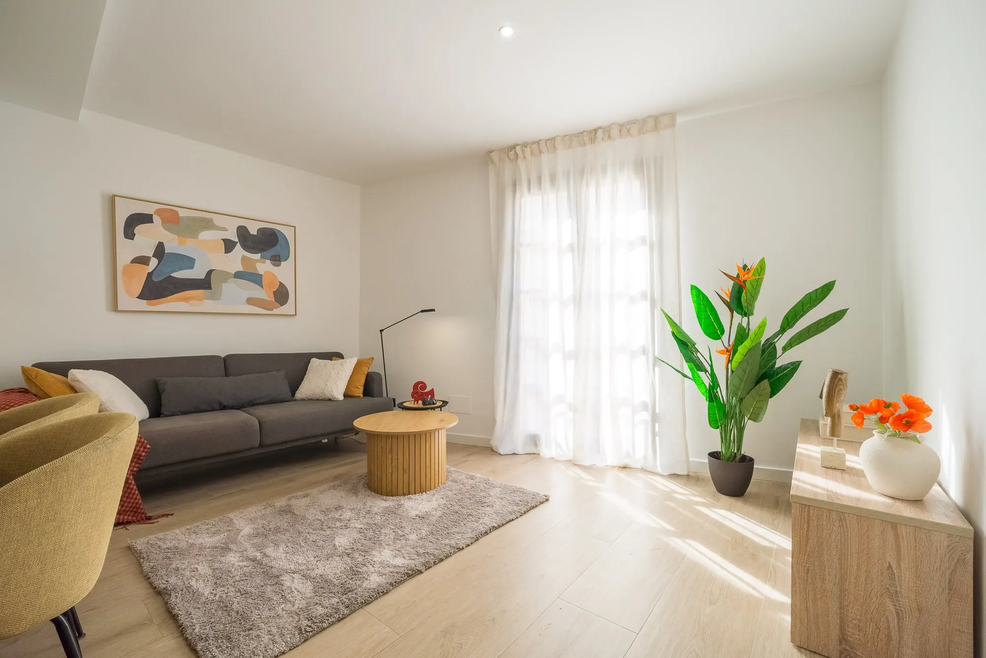 Living room of the Riera Baixa I project, in Barcelona, after home staging