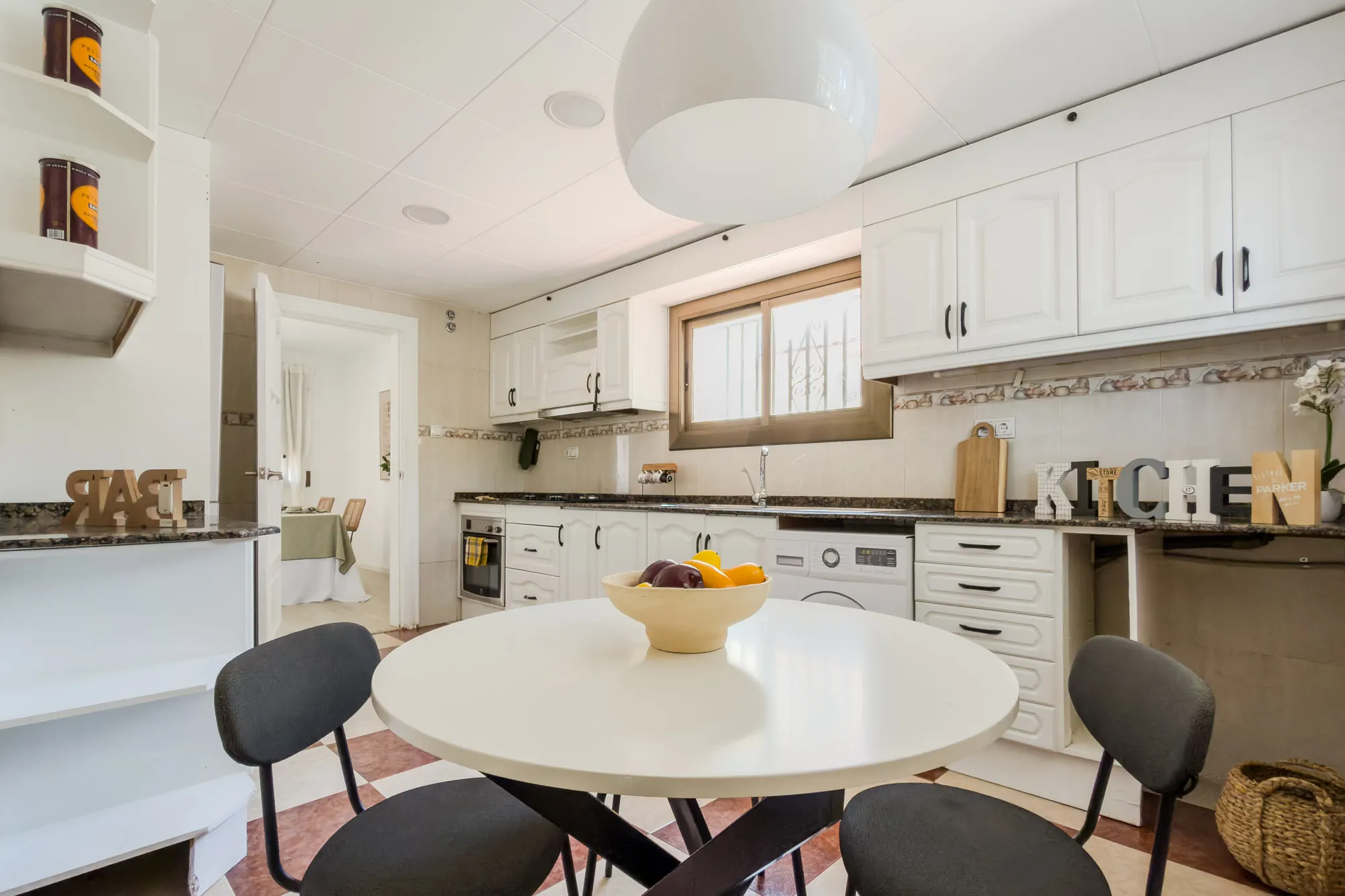 Kitchen and dining room of the Galícia project, in Sant Cugat del Vallès, after home staging