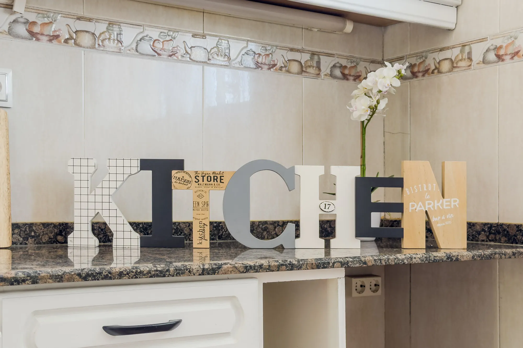 Kitchen, detail of the Galícia project, in Sant Cugat del Vallès, after home staging