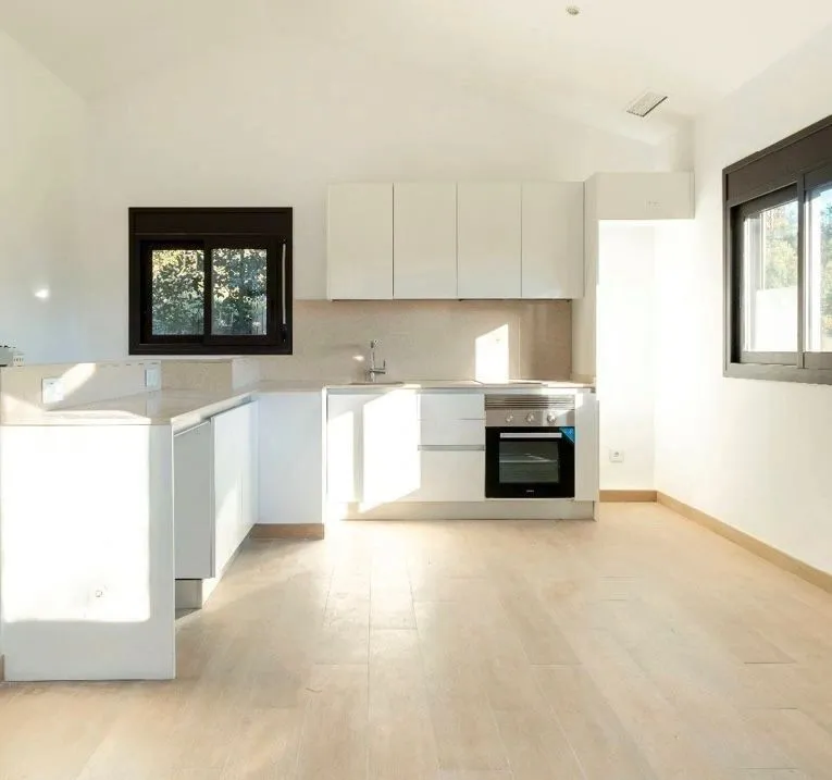 Before: Kitchen and dining room of a flat in Valldoreix